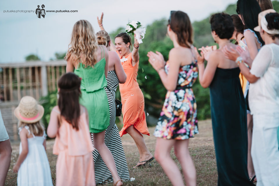 Happy expression from the girl who catch the bouquet