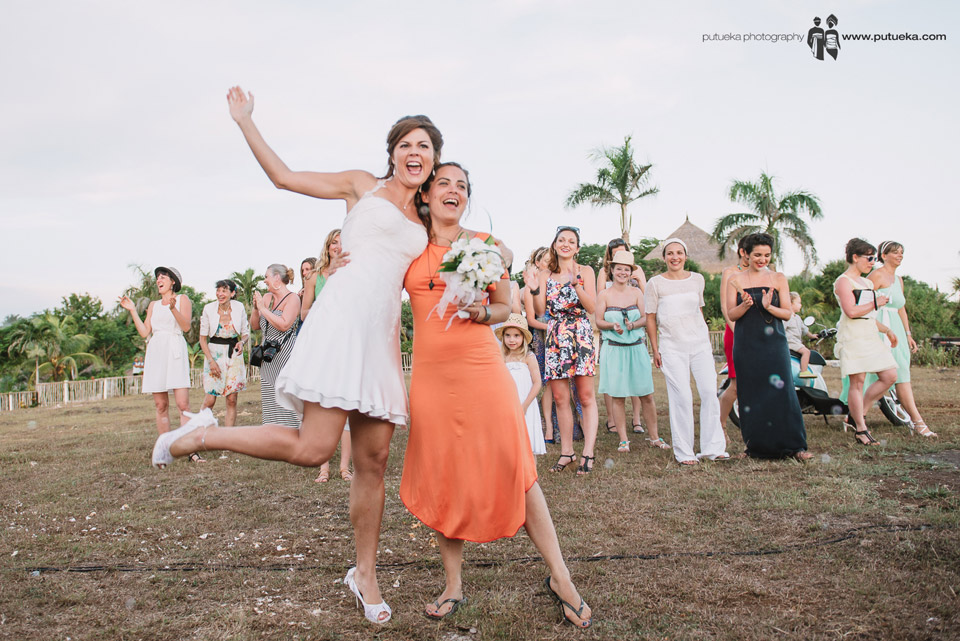 The bride and the girl who catch the bouquet on bouquet toss