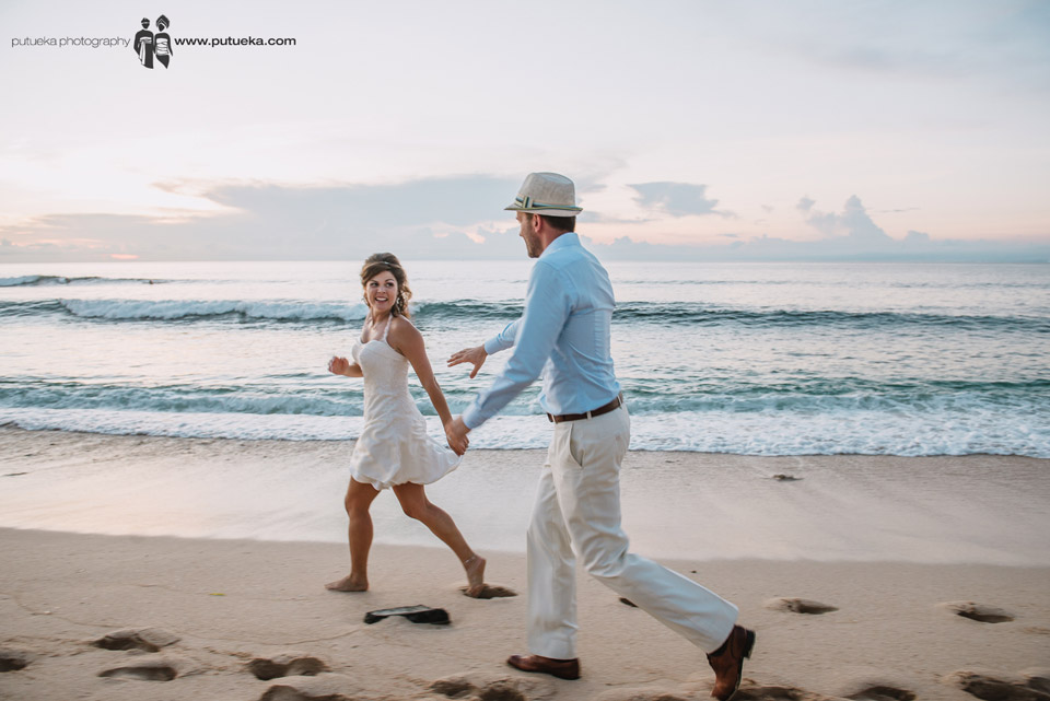 Running on the sand as a husband and wife