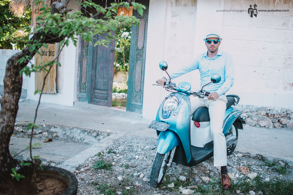 Perrick ready to ride blue scooter from villa to wedding venue