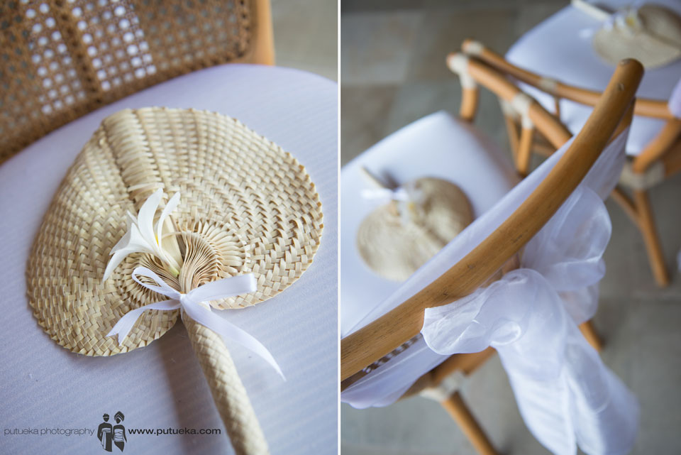 Hand fan for guest on the white brown chair