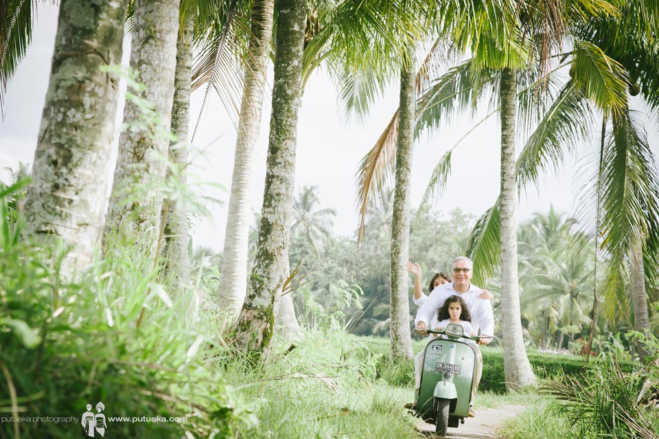Memorable moment for the kids riding scooter with father in Ubud Bali