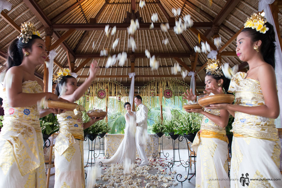 Boris and Jessie first dance under flower shower on their Amankila Bali wedding