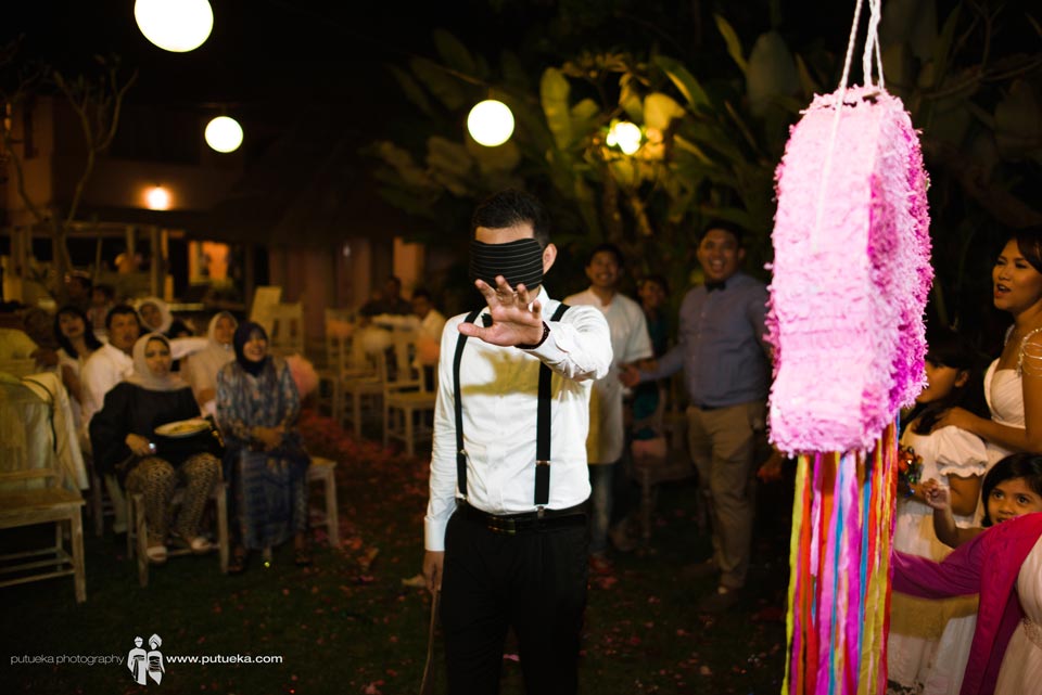 Hakim looking for piñata blindfolded