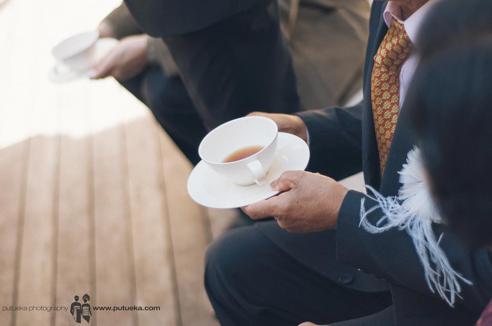 Father holding cup of tea