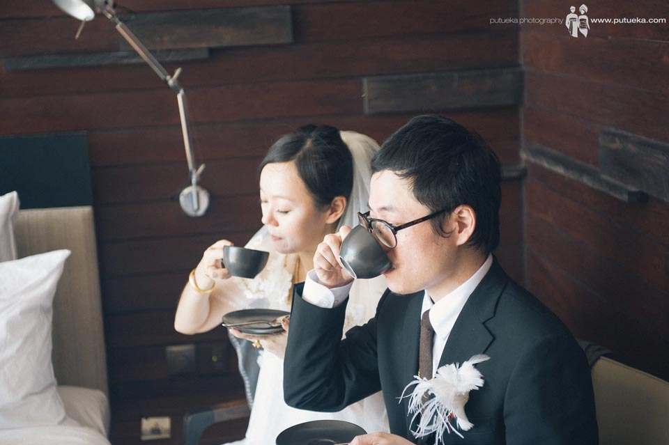 Bride and grrom drinking tea together