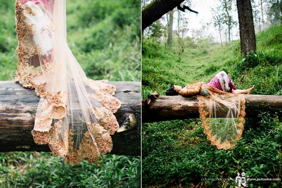 Laying down on big fallen tree wearing gorgeous kebaya on pre wedding session in Kintamani Bali