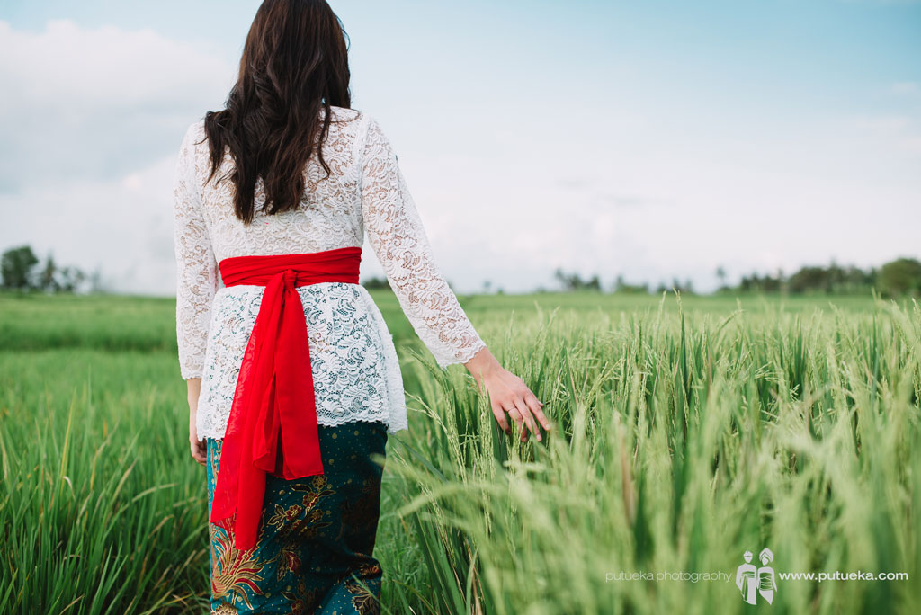 Ms Lina daughter walking through rice fields