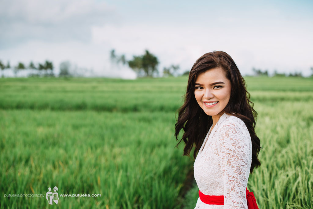 Sweet smile with the gorgeous scenery of Bali rice fields